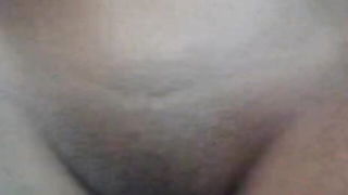 Explicit massage scene in a softly lit room