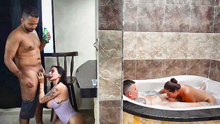 Amateur couple on a living room sofa in explicit scene