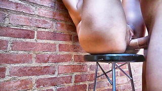 Explicit massage scene in a softly lit room