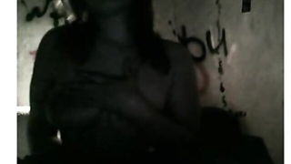 Couple mid-scene in a dim bedroom