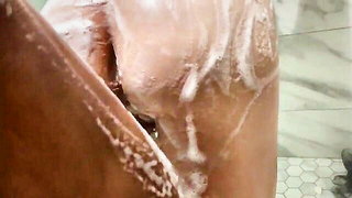 Explicit massage scene in a softly lit room