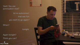 Couple mid-scene in a dim bedroom