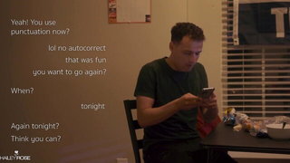 Couple mid-scene in a dim bedroom