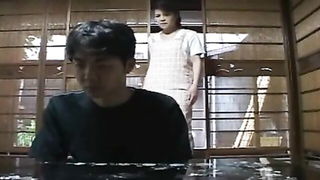 Pair of performers in motion on a wide bed