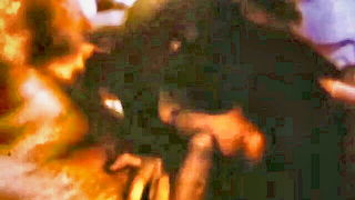Couple on a made bed in an explicit scene