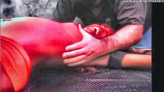 Couple on a made bed in an explicit scene