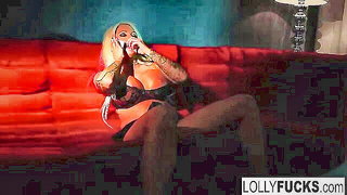 Solo performer with a toy on rumpled bedsheets