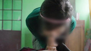 Amateur couple on a living room sofa in explicit scene