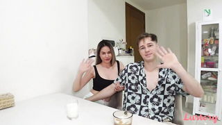 Couple mid-scene in a dim bedroom