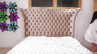 Pair of performers in motion on a wide bed