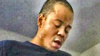 Explicit massage scene in a softly lit room