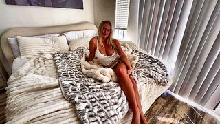 Explicit massage scene in a softly lit room
