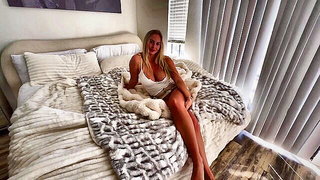 Explicit massage scene in a softly lit room