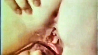 Couple on a made bed in an explicit scene