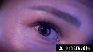 Explicit massage scene in a softly lit room