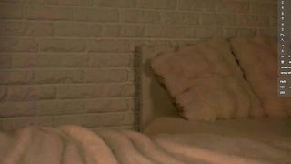 Amateur couple on a living room sofa in explicit scene