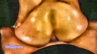 Couple on a patterned bedspread in an explicit scene