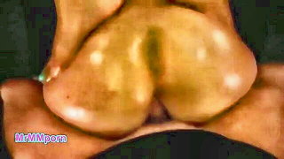 Couple on a patterned bedspread in an explicit scene