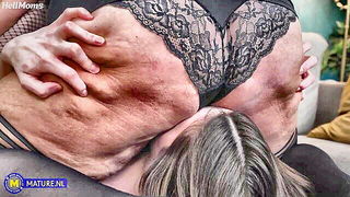 Couple on a made bed in an explicit scene