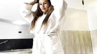 Explicit massage scene in a softly lit room