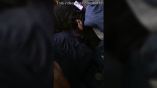 Couple mid-scene in a dim bedroom