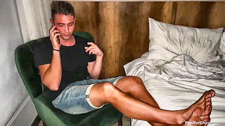 Amateur couple on a living room sofa in explicit scene
