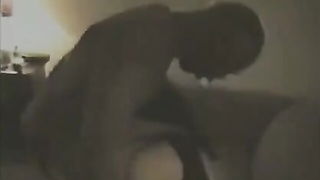 Explicit doggy style scene on a wide bed