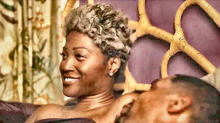Explicit massage scene in a softly lit room