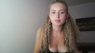 Explicit massage scene in a softly lit room