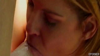 Explicit massage scene in a softly lit room