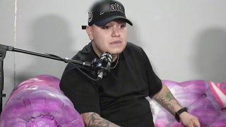 Explicit doggy style scene on a wide bed