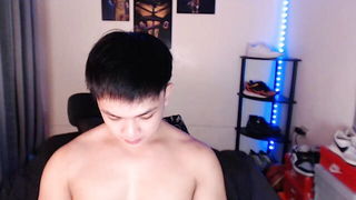 Explicit massage scene in a softly lit room