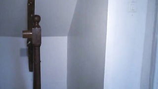 Amateur couple on a living room sofa in explicit scene