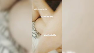 Amateur couple on a living room sofa in explicit scene