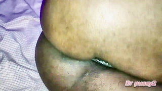 Amateur couple on a living room sofa in explicit scene