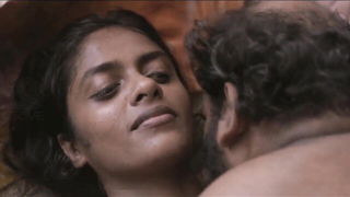 Explicit massage scene in a softly lit room