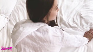 Amateur couple on a living room sofa in explicit scene