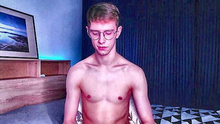 Amateur couple on a living room sofa in explicit scene