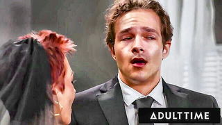 Amateur couple on a living room sofa in explicit scene