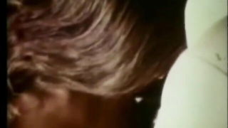 Explicit massage scene in a softly lit room