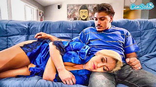 Couple mid-scene in a dim bedroom