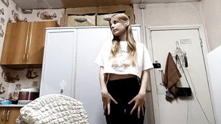 Solo performer with a toy on rumpled bedsheets