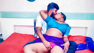 Solo performer with a toy on rumpled bedsheets