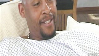 Couple on a made bed in an explicit scene