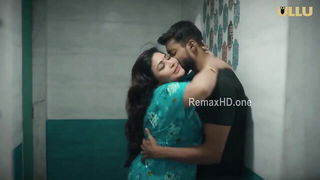 Couple mid-scene in a dim bedroom