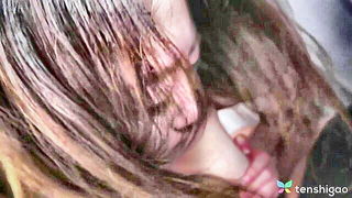 Explicit massage scene in a softly lit room