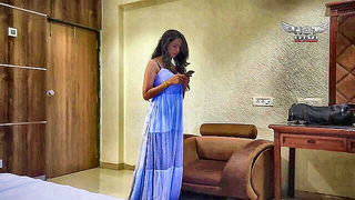 Couple mid-scene in a dim bedroom