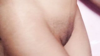 Amateur couple on a living room sofa in explicit scene