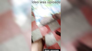 Couple mid-scene in a dim bedroom