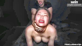 Couple on a made bed in an explicit scene